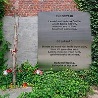 World War One execution pole and epitaph The Coward by Rudyard Kipling at inner courtyard of the Poperinge town hall, Belgium